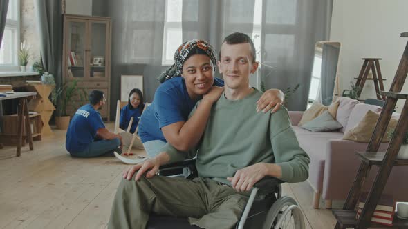 Portrait of Disabled Man with Female Volunteer