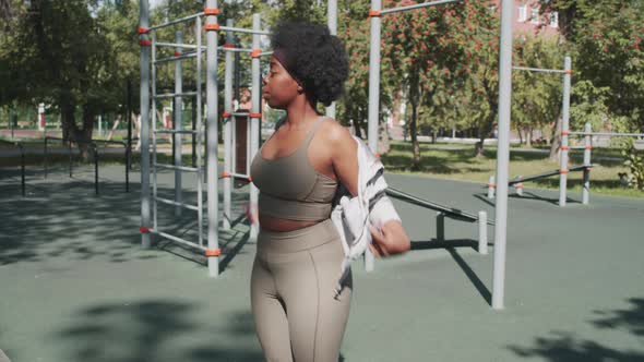Plus Size Black Woman Warming Up at Outdoor Training