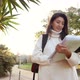 Slow Motion Cheerful Female Tourist in Eyeglasses Installing Navigator on Modern Telephone Device - VideoHive Item for Sale