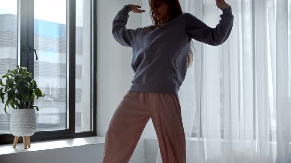 Young Woman Dancing in the Room