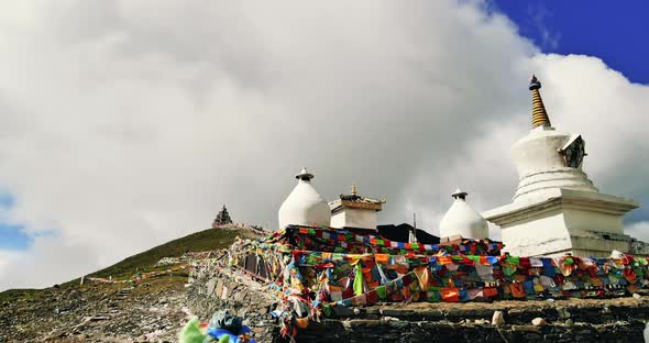 Prayer Flags And White Pagoda On The Mountains