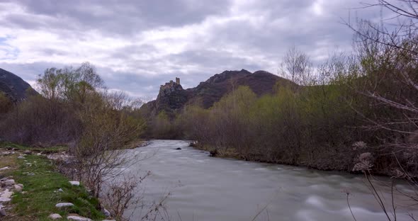 Time lapse shot of Drisi Castle situated on a mountain above the Tedzami River gorge. Georgia 2022