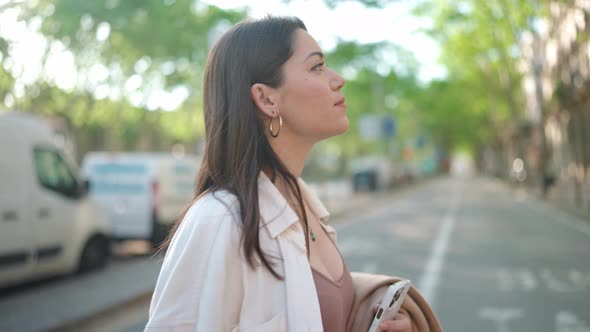 Concentrated brunette woman walking