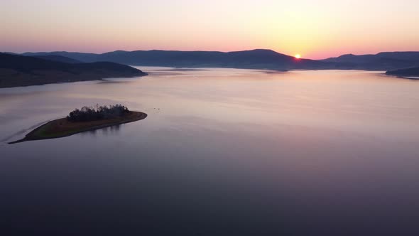 Aerial Panoramic View of Island on a Batak Reservoir in Sunrise Rhodopa Mountains Bulgaria