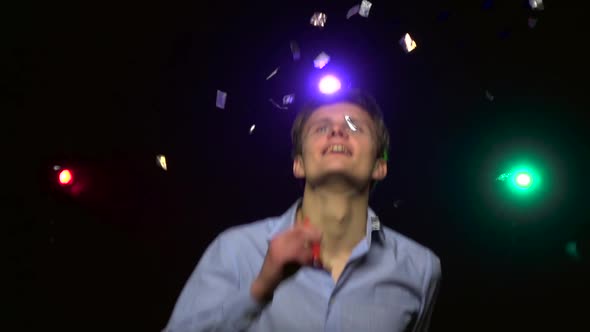 Man Throwing Confetti, Blowing Party Whistle, Dance. Close-up. Slow Motion