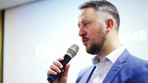 Businessman speaking at a podium in a conference or seminar