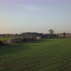 Aerial Cinematic Clip Drone Flying Over a Farm Field During Sunset - VideoHive Item for Sale