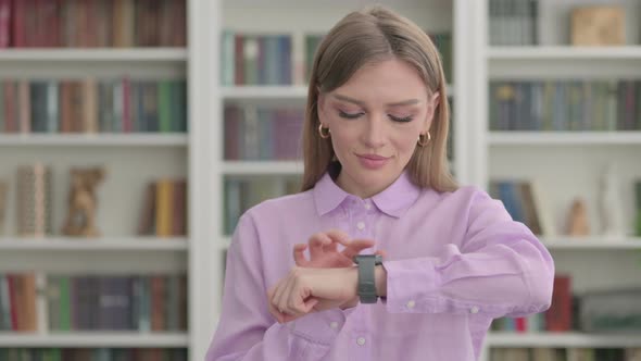 Portrait of Woman Using Smart Watch