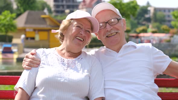 Happy Life Retired Grandparents They Sit on a Bench in San Francisco Park USA