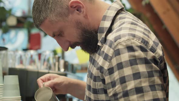 Proffesional barista makes cappuccino