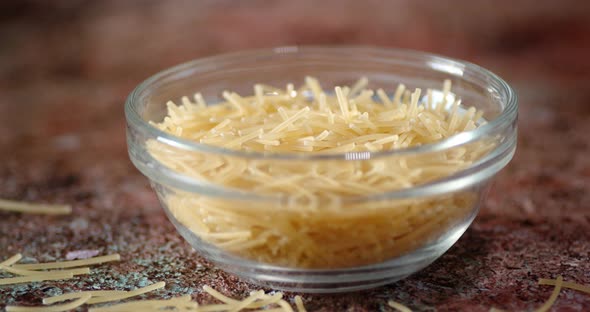 Dry Pasta Vermicelli in Glass Bowl Slowly Rotating