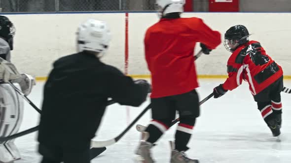 Novice Ice Hockey Players Practicing