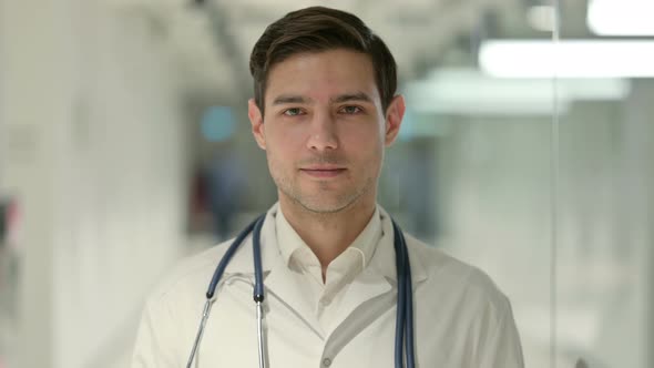 Portrait of Male Doctor Looking at the Camera