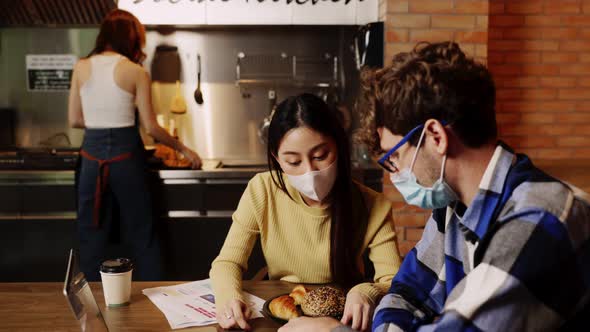 young asian woman and caucasian man Business people Working discuss finding new strategy