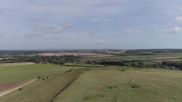 Aerial tracking along the northern ramparts of Maiden castle towards the eastern gate. The Roman tem