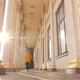 The Girl Walks Past Beautiful Historical Columns - VideoHive Item for Sale