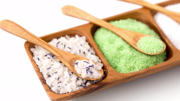 Different Bath Salts with Wooden Spoons on Tray