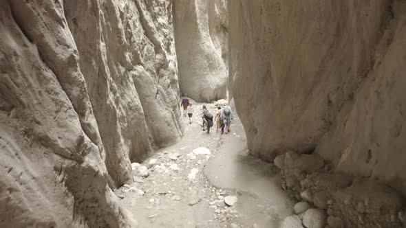 Drone Flying Through Narrow Canyon in Mountains