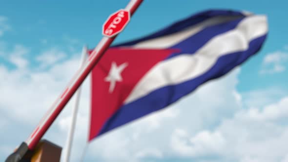 Closing Boom Barrier with Stop Sign at the Cuban Flag alt