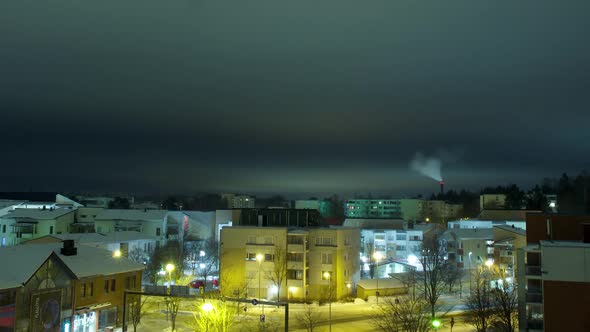 Pan timelapse showing the nighttime skyline of Helsinki, lights in buildings turning on and off.