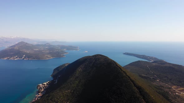 aerial view over mountain peak in the Bay of Kotor in Montenegro, on a summer clear day