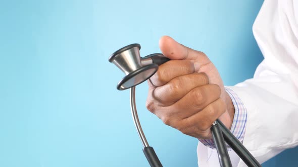 Close Up of Doctor Hand Holding Stethoscope with Copy Space