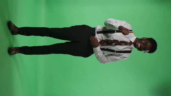 Portrait of Young African American Man Looking at Camera Smiling and Showing Thumbs Up Gesture