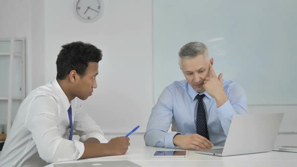 Boss Businessman Giving Dictation to Employee at Work Paperwork