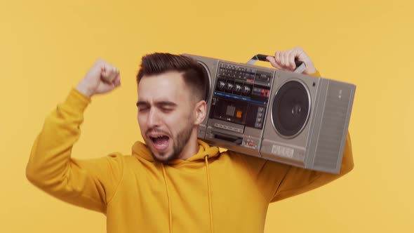 Expressive young man screaming and shouting over vibrant background.