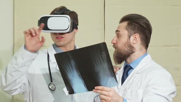 Male Doctor Wearing Vr Glasses His Colleague Examining X-ray of a Patient