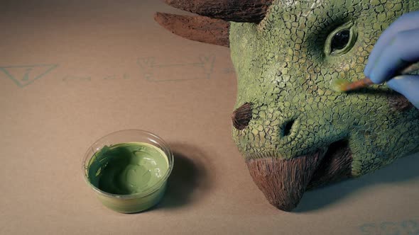 Dinosaur Triceratops Model Head Being Painted