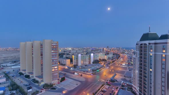 Aktau City After Sunset on the Shore of the Caspian Sea Day To Night Timelapse. Kazakhstan.