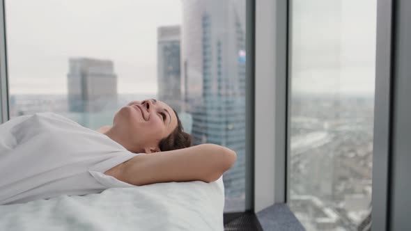 Calm Young Woman Having Healthy Daytime Sleep Napping Relaxing on Comfortable Bed with Closed Eyes