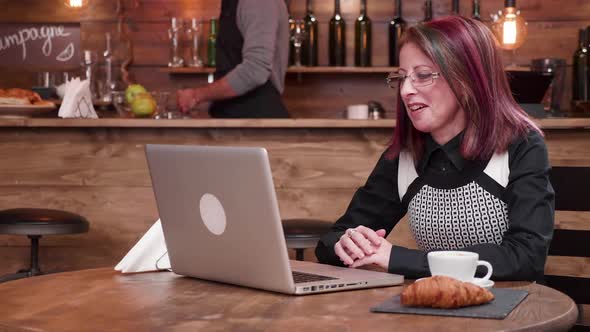 Adult Mature Businesswoman in Her 40s Having a Video Call Conference