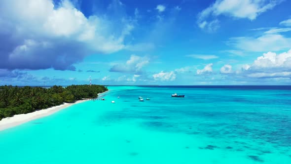 Aerial top down seascape of relaxing lagoon beach break by transparent sea with white sandy backgrou
