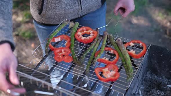 Making Grilled Vegetables  Asparagus and Red Pepper on a Charcoal Grill