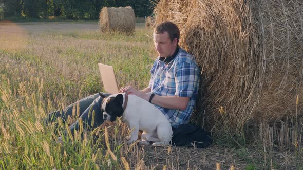 Guy Working on Computer Meadow