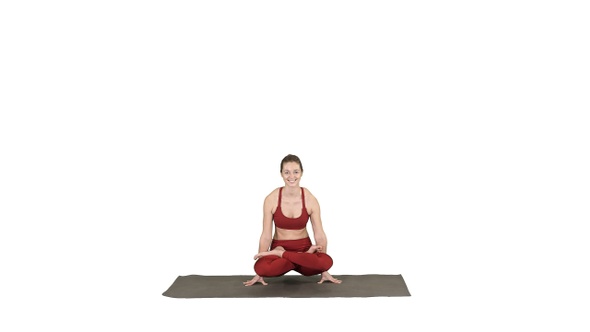 Young sporty woman practicing yoga doing Scale exercise,