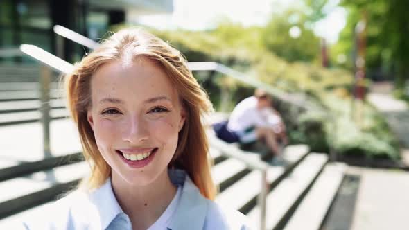 Smiling Pretty Girl University Student Looking at Camera Portrait Outdoors