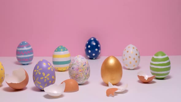 Colorful Painted Easter Eggs on the Pink Table