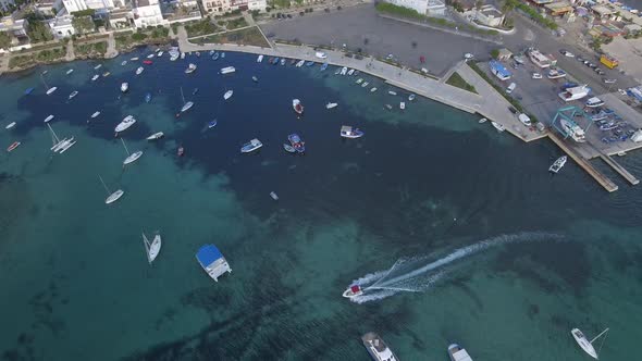 Beautiful tourist port aerial view with emerald water in southern Italy