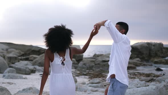 Couple dancing together on the beach 4k