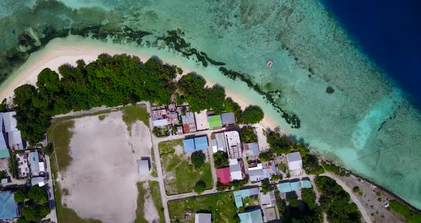 Tropical birds eye island view of a white sandy paradise beach and blue sea background in best quali