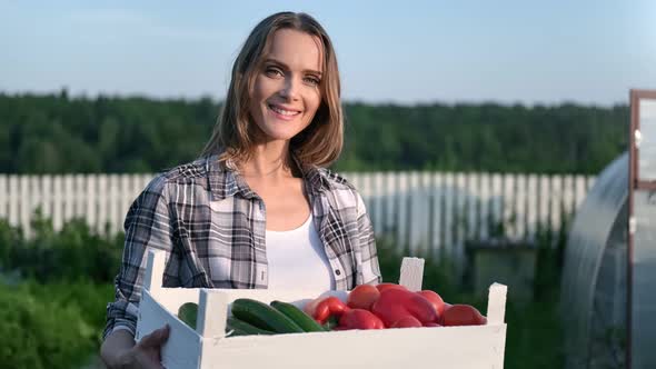 Feminine Posing with Seasonal Harvest at Greenhouse Background