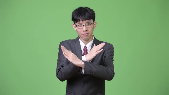Young Asian Businessman with Stop Gesture