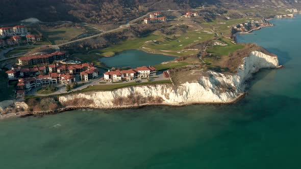 Landscape with golf resort at picturesque rocky coastline