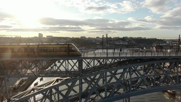 Shuttle Tram Moves Along Historical Metal Ponte Luis Bridge