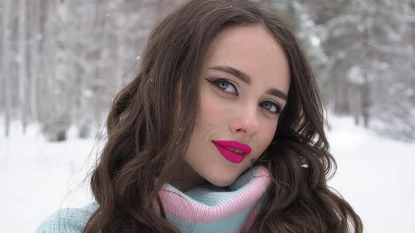 Beautiful Woman in Snowy Countryside