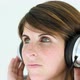 Teenage girl wearing headphones and listening to music - VideoHive Item for Sale