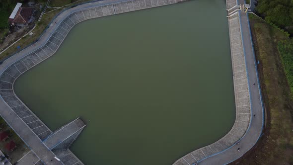 Aerial view of "Embung Imogiri" a reservoir with a puppet-like shape in Yogyakarta, Indonesia